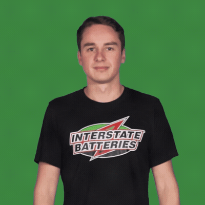 Man In Interstate Batteries T-Shirt Pointing GIF