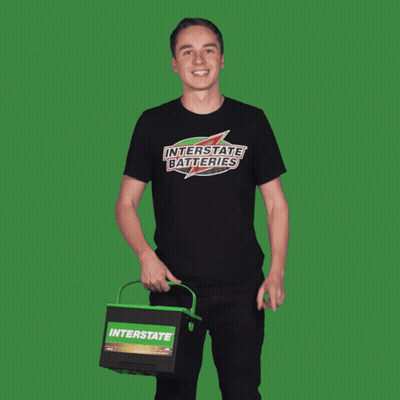 Man In Interstate Batteries T-Shirt Pointing Up GIF