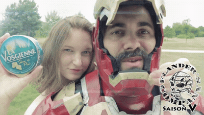 Man In Iron Man Costume Holding Can Of Vosgienne GIF