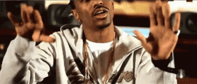 Man In Jacket And Necklace Making Funny Face Arms Up GIF