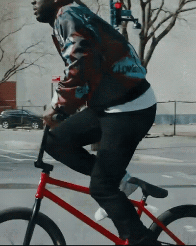 Man In Jacket Saying Love Riding Red Bike GIF