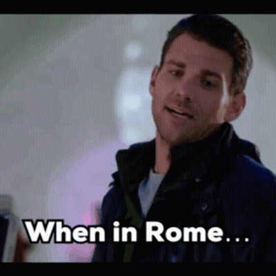 Man In Jacket Saying When In Rome GIF