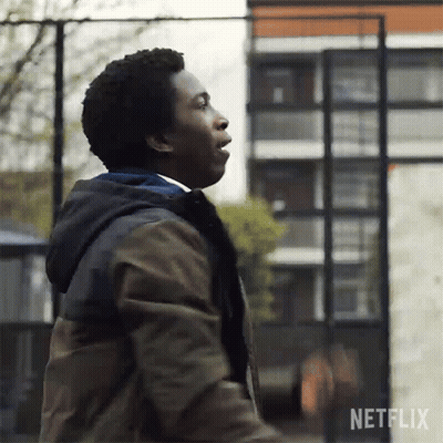 Man In Jacket Standing In Front Of Basketball Hoop GIF