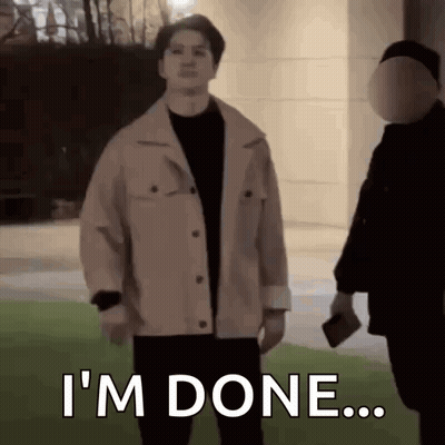 Man In Jacket Standing Next To Man In Mask GIF