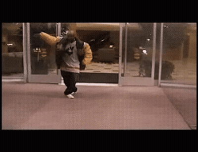 Man In Jacket With Number 4 Walking Through Doorway GIF