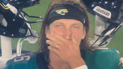 Man In Jaguars Headband Covering Mouth GIF