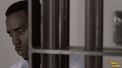 Man In Jail Cell With Brown Sugar Logo GIF