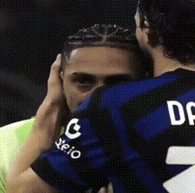 Man In Jersey Number 2 Hugging Another Man GIF
