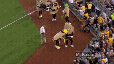 Man In Jersey Number 69 Next To Mascot GIF