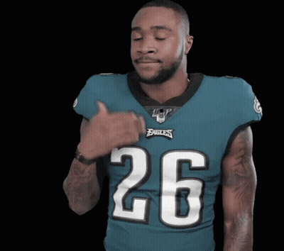 Man In Jersey Number 9 Jumping On Couch GIF