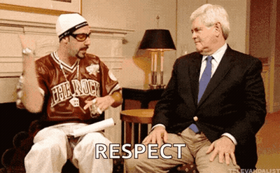Man In Jersey Saying The Rock Sitting Next To Man In Suit Saying Respect GIF