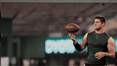 Man In Jets Shirt Holding Football GIF