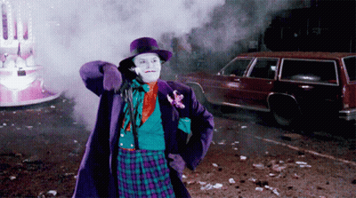 Man In Joker Costume Standing In Front Of Car GIF
