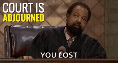 Man In Judge Robe Sitting At Podium In Courtroom GIF