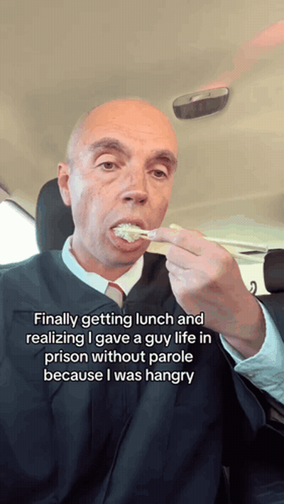 Man In Judge's Robe Eating Food GIF