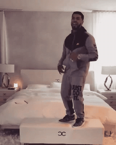 Man In Just Do It Outfit Standing On Stool GIF