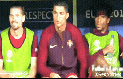 Man In Kafd Shirt In Front Of Men GIF