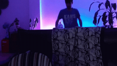 Man In Kane Shirt By Purple Light GIF