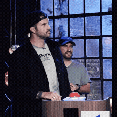 Man In Kani T-Shirt At Podium GIF