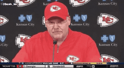 Man In Kansas City Hat In Front Of Kansas City Logos GIF