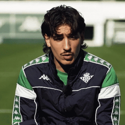 Man In Kappa Jacket Looking Down GIF