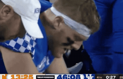 Man In Kentucky Hat And Headband Checking Time Of Possession GIF