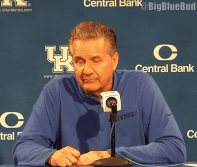 Man In Kentucky Shirt Sitting At Table With Microphone GIF