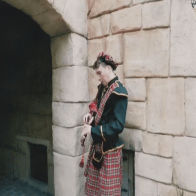 Man In Kilt By Stone Wall GIF
