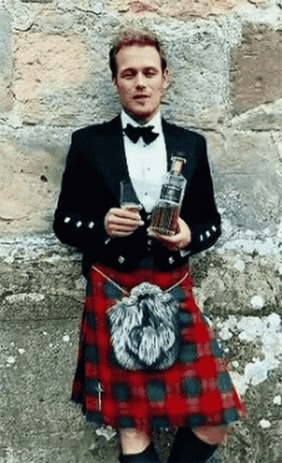 Man In Kilt Holding Whisky Bottle And Glass GIF
