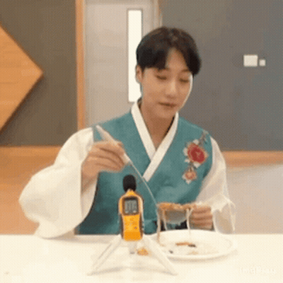 Man In Kimono With Plate Of Food GIF