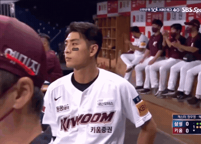 Man In Kingdom Jersey In Front Of Baseball Players GIF