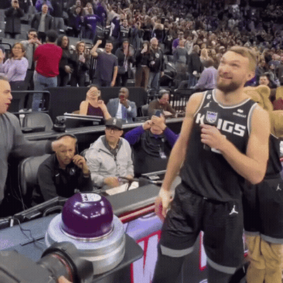 Man In Kings Jersey Standing In Front Of Crowd GIF