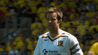 Man In Kingston Communications Jersey On Soccer Field GIF