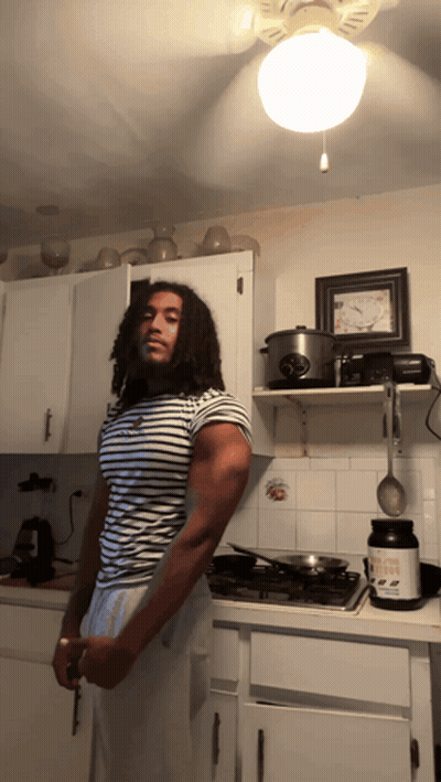 Man In Kitchen Holding Knife And Protein GIF