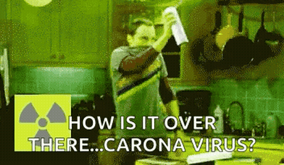 Man In Kitchen Holding Paper Asking How Is It Over There Corona Virus GIF