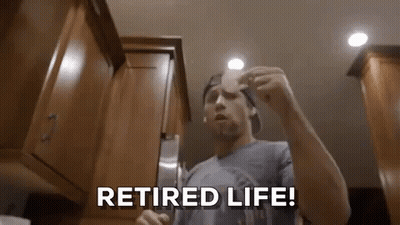 Man In Kitchen Holding Paper Saying Retired Life GIF