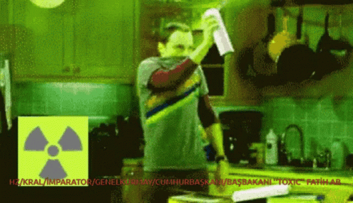 Man In Kitchen With Radioactive Symbol GIF