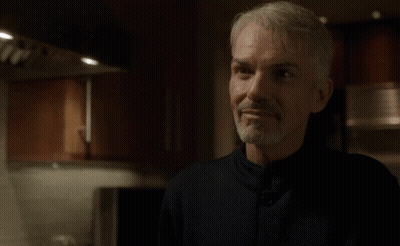 Man In Kitchen With Word Aces Above Head GIF