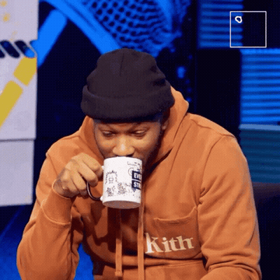 Man In Kith Sweatshirt Drinking From Cup GIF