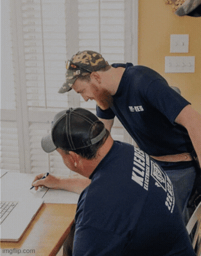 Man In Klein Electrical Works Shirt GIF