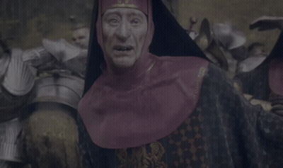 Man In Knight's Armor Facing Crowd GIF