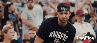 Man In Knights Shirt In Front Of Crowd GIF