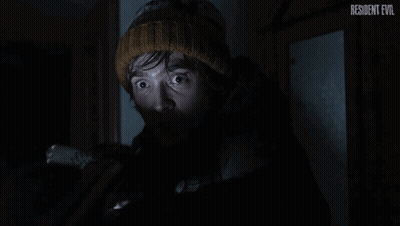Man In Knitted Hat Looking In Dark Resident Evil GIF