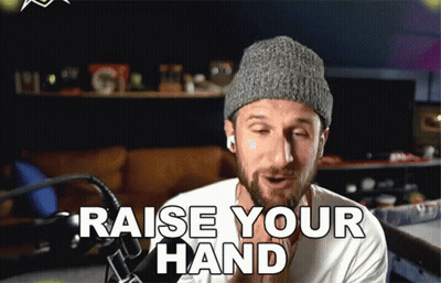 Man In Knitted Hat Saying Raise Your Hand GIF
