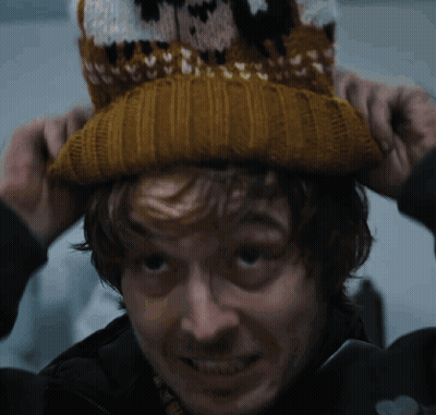 Man In Knitted Hat With Sheep GIF