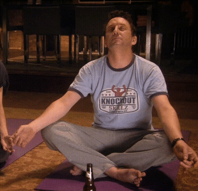 Man In Knockout Shirt On Yoga Mat GIF