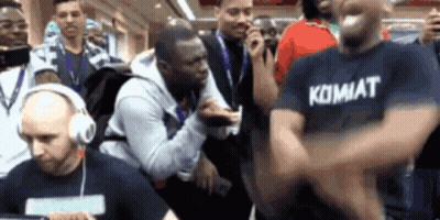 Man In Kombat Shirt Dancing In Crowd GIF