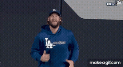 Man In LA Dodgers Sweatshirt Running On Baseball Field GIF
