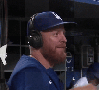 Man In LA Hat And Headphones Talking Into Microphone GIF