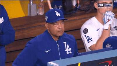 Man In LA Hat In Dugout GIF
